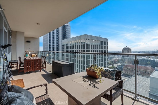 3785 Wilshire Blvd Unit 1605, Los Angeles, CA 90010 - balcony with outdoor dining area and a view of city