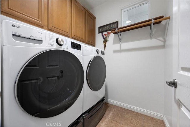 10705 Topiary Dr, Bakersfield, CA 93306 - laundry area featuring washing machine and dryer, cabinet space, and tile patterned floors