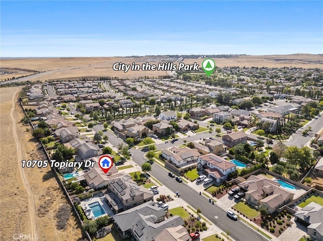 10705 Topiary Dr, Bakersfield, CA 93306 - aerial perspective of suburban area featuring a pool area