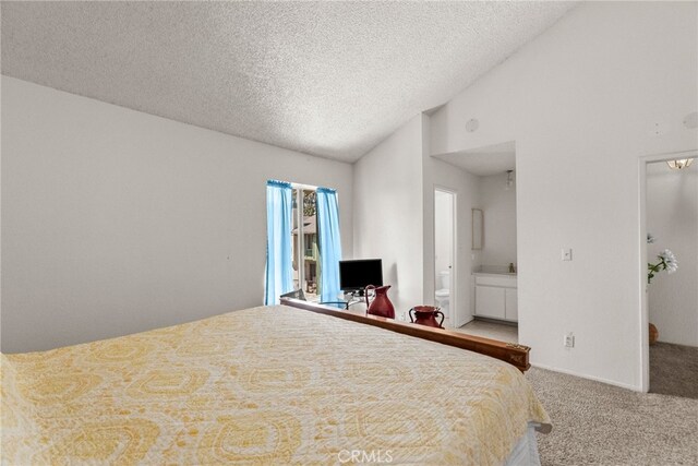 9740 Sepulveda Blvd Unit 20, North Hills, CA 91343 - bedroom with carpet flooring, a textured ceiling, ensuite bath, and high vaulted ceiling