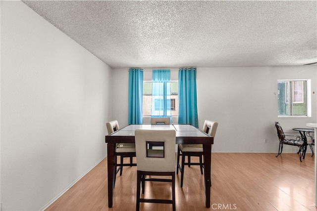9740 Sepulveda Blvd Unit 20, North Hills, CA 91343 - dining room with a textured ceiling and light wood-type flooring