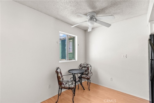 9740 Sepulveda Blvd Unit 20, North Hills, CA 91343 - sitting room featuring a textured ceiling, light wood-style flooring, and a ceiling fan