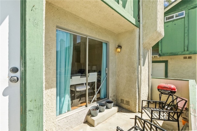 9740 Sepulveda Blvd Unit 20, North Hills, CA 91343 - doorway to property featuring stucco siding