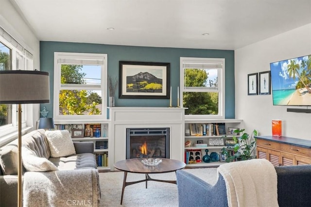 1620 Alrita St, San Luis Obispo, CA 93401 - living room featuring healthy amount of natural light and a warm lit fireplace