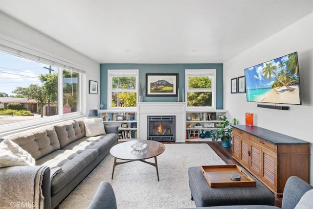 1620 Alrita St, San Luis Obispo, CA 93401 - living area featuring a glass covered fireplace and wood finished floors