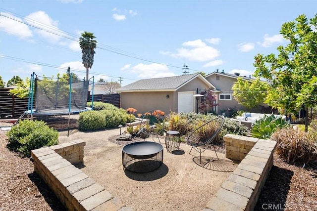 1620 Alrita St, San Luis Obispo, CA 93401 - view of front of house featuring an outdoor structure, a trampoline, a patio area, and stucco siding