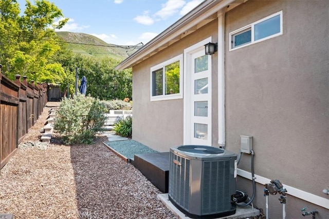 1620 Alrita St, San Luis Obispo, CA 93401 - view of side of property with stucco siding, a fenced backyard, and a mountain view