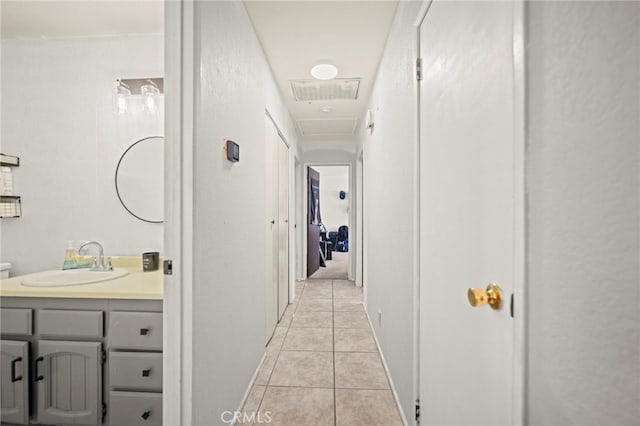 27636 Ethanac Rd, Menifee, CA 92585 - corridor featuring a sink and light tile patterned floors