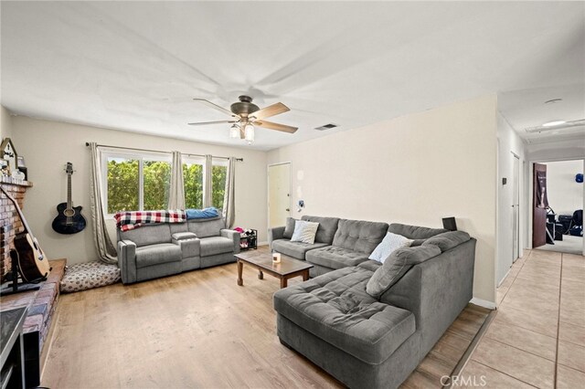 27636 Ethanac Rd, Menifee, CA 92585 - living area with ceiling fan and light wood-style flooring