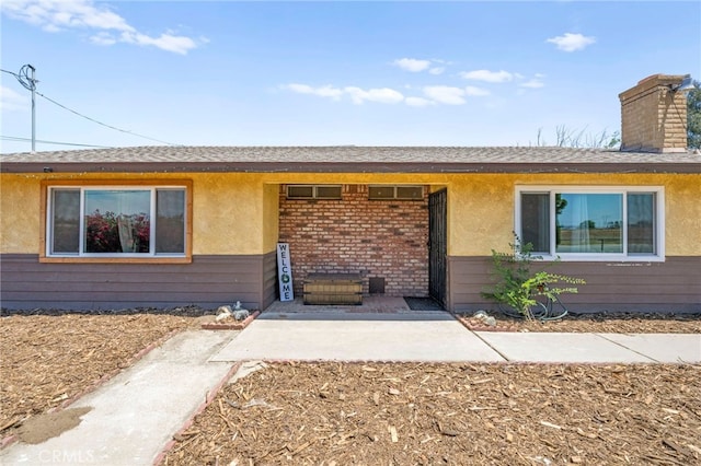 27636 Ethanac Rd, Menifee, CA 92585 - view of front of home featuring a chimney and stucco siding