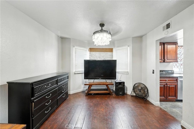 13905 Caspian Way, Moreno Valley, CA 92553 - living area with a chandelier and dark wood finished floors