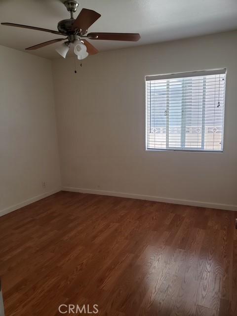 5342 W W Ave L8, Lancaster, CA 93536 - unfurnished room featuring wood finished floors and a ceiling fan
