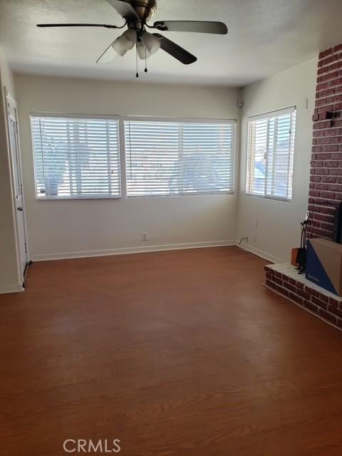 5342 W W Ave L8, Lancaster, CA 93536 - unfurnished living room featuring ceiling fan and wood finished floors