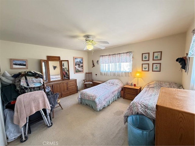 59663 Sunway Dr, Yucca Valley, CA 92284 - bedroom featuring light colored carpet and ceiling fan