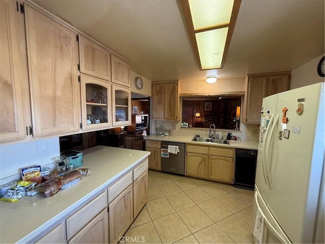59663 Sunway Dr, Yucca Valley, CA 92284 - kitchen featuring freestanding refrigerator, stainless steel dishwasher, light countertops, light tile patterned floors, and glass insert cabinets