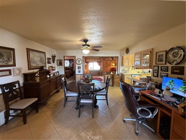 59663 Sunway Dr, Yucca Valley, CA 92284 - dining room featuring a ceiling fan, a desk, light tile patterned floors, and a textured ceiling