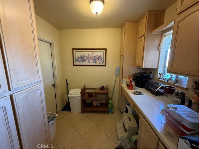 59663 Sunway Dr, Yucca Valley, CA 92284 - kitchen with light tile patterned floors, light countertops, and light brown cabinets