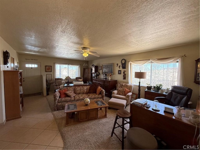 59663 Sunway Dr, Yucca Valley, CA 92284 - living area with a textured ceiling, healthy amount of natural light, light tile patterned floors, and ceiling fan