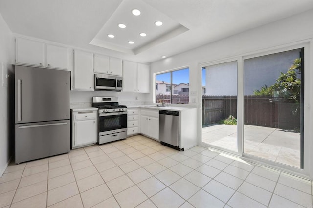 3418 Seabreeze Walk, Oceanside, CA 92056 - kitchen featuring appliances with stainless steel finishes, light countertops, recessed lighting, and white cabinetry