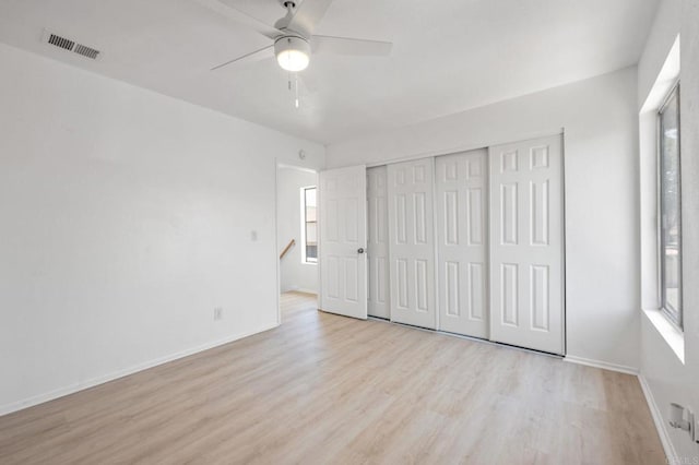 3418 Seabreeze Walk, Oceanside, CA 92056 - unfurnished bedroom with wood finished floors, a closet, and a ceiling fan