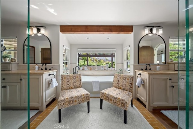 8300 San Diego Rd, Atascadero, CA 93422 - full bath with two vanities, a freestanding tub, a wainscoted wall, and beamed ceiling