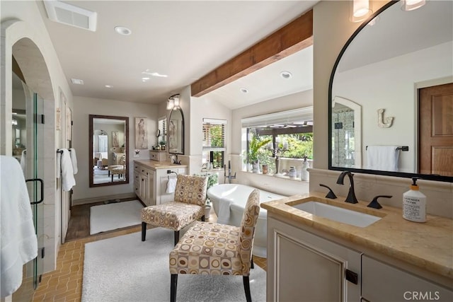 8300 San Diego Rd, Atascadero, CA 93422 - full bathroom with two vanities, brick patterned flooring, a soaking tub, a shower stall, and recessed lighting