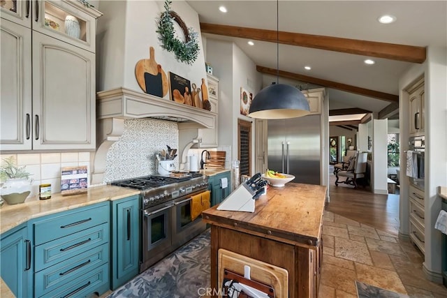8300 San Diego Rd, Atascadero, CA 93422 - kitchen featuring stainless steel appliances, blue cabinets, tasteful backsplash, stone tile flooring, and recessed lighting