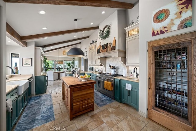 8300 San Diego Rd, Atascadero, CA 93422 - kitchen with range with two ovens, recessed lighting, stone tile floors, wooden counters, and a kitchen island