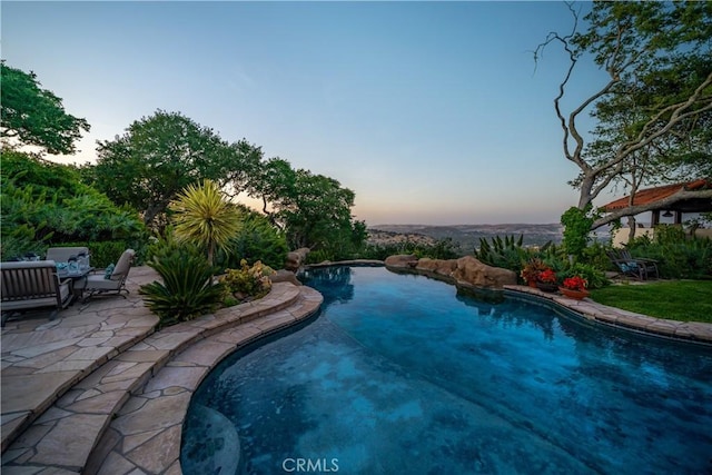 8300 San Diego Rd, Atascadero, CA 93422 - pool at dusk with a patio area and an outdoor pool