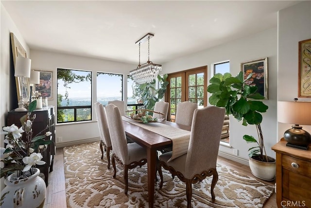 8300 San Diego Rd, Atascadero, CA 93422 - dining area with light wood-type flooring and a chandelier