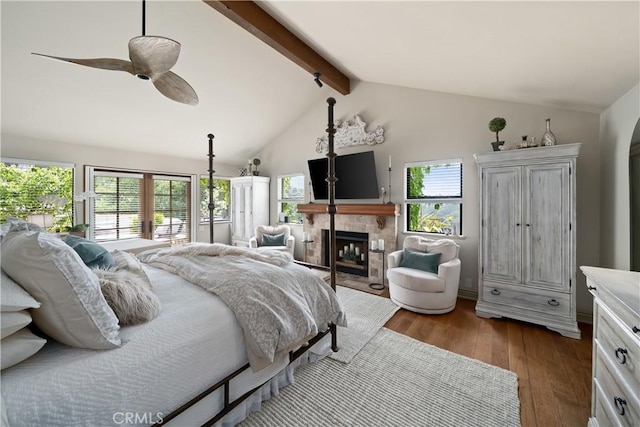 8300 San Diego Rd, Atascadero, CA 93422 - bedroom with wood finished floors, a tile fireplace, and a ceiling fan