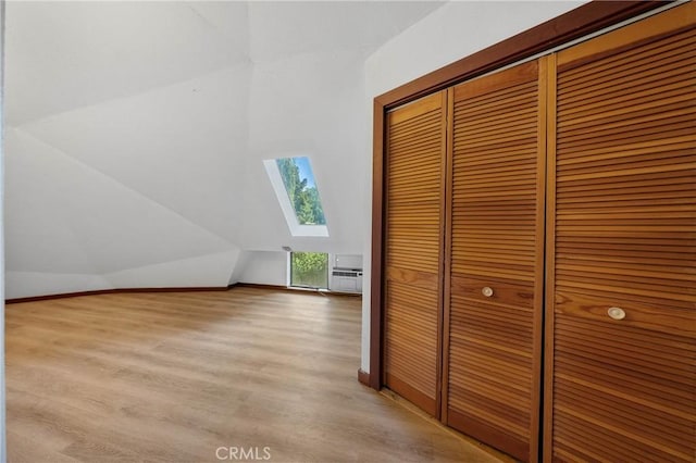 8201 W W Side Potter Valley Rd, Potter Valley, CA 95469 - additional living space with a skylight, light wood-style flooring, and lofted ceiling