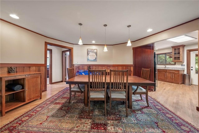 8201 W W Side Potter Valley Rd, Potter Valley, CA 95469 - dining room featuring a wainscoted wall, ornamental molding, light wood-type flooring, and recessed lighting