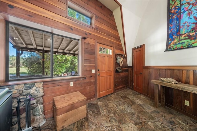 8201 W W Side Potter Valley Rd, Potter Valley, CA 95469 - entrance foyer featuring wood walls, dark stone finish floors, wainscoting, and high vaulted ceiling