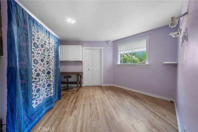 8201 W W Side Potter Valley Rd, Potter Valley, CA 95469 - unfurnished bedroom featuring light wood finished floors and a closet