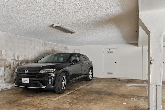 155 Rosebay Dr Unit 31, Encinitas, CA 92024 - parking garage featuring concrete block wall