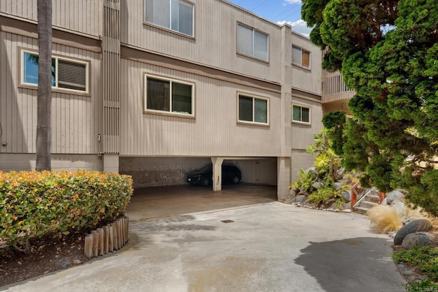 155 Rosebay Dr Unit 31, Encinitas, CA 92024 - view of property exterior with an attached garage and concrete driveway