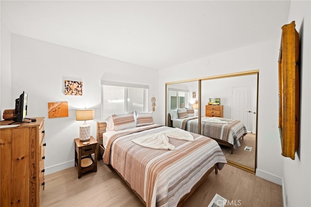 1924 W Oceanfront, Newport Beach, CA 92663 - bedroom with light wood-type flooring and a closet