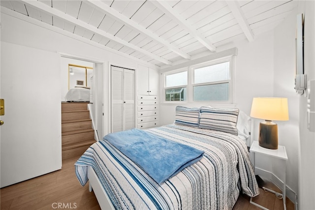 1924 W Oceanfront, Newport Beach, CA 92663 - bedroom with wood finished floors, wooden ceiling, and a closet