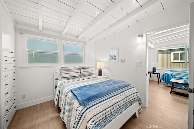 1924 W Oceanfront, Newport Beach, CA 92663 - bedroom featuring light wood-type flooring and a wood ceiling with exposed beams
