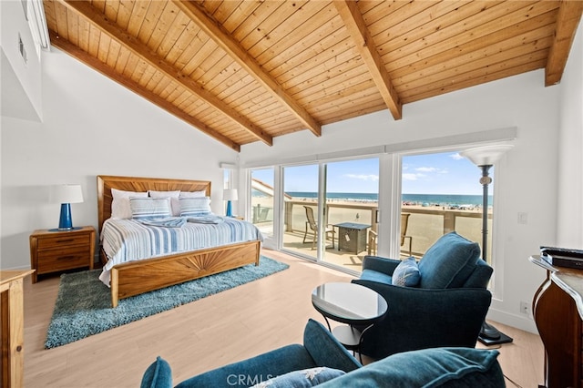 1924 W Oceanfront, Newport Beach, CA 92663 - bedroom featuring wood ceiling, access to exterior, view of water and beach, multiple windows, and wood finished floors