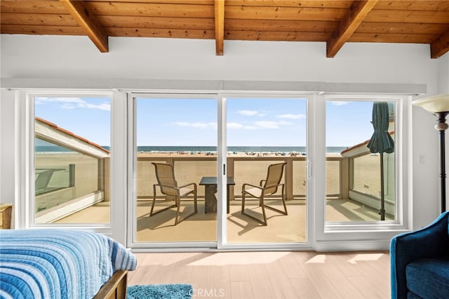 1924 W Oceanfront, Newport Beach, CA 92663 - bedroom with a wooden ceiling with exposed beams, access to outside, and wood finished floors