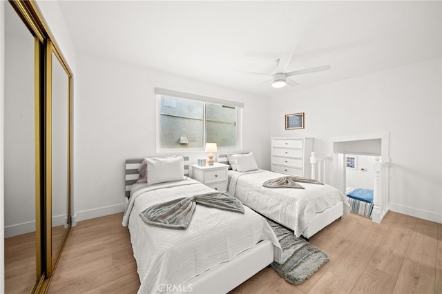 1924 W Oceanfront, Newport Beach, CA 92663 - bedroom with a closet, light wood-style flooring, and ceiling fan