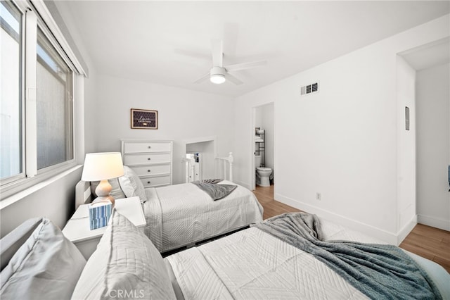 1924 W Oceanfront, Newport Beach, CA 92663 - bedroom with wood finished floors, a ceiling fan, and ensuite bathroom