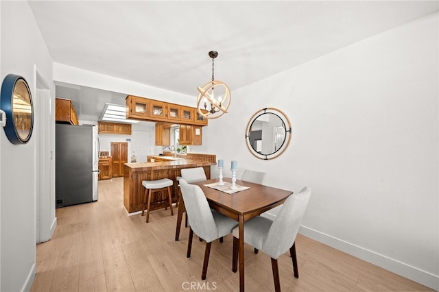 1924 W Oceanfront, Newport Beach, CA 92663 - dining space with a chandelier and light wood-style floors