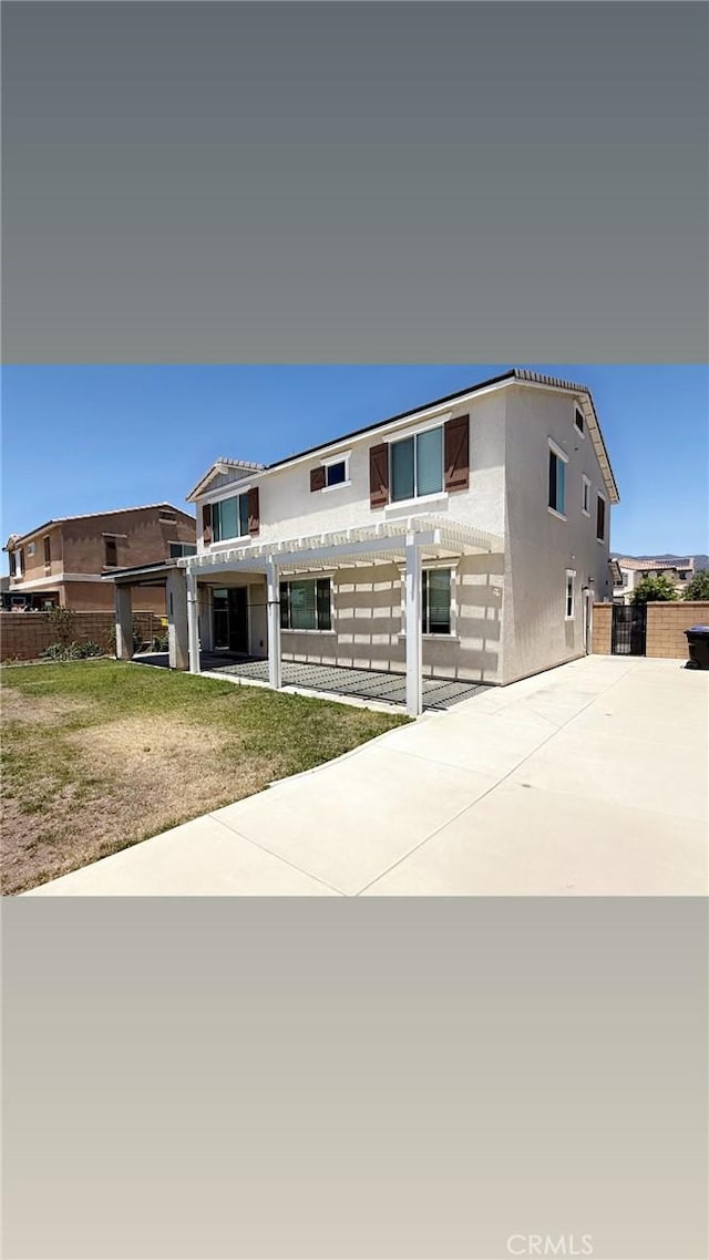16009 Pitzer St, Fontana, CA 92336 - contemporary house with a pergola, concrete driveway, and stucco siding