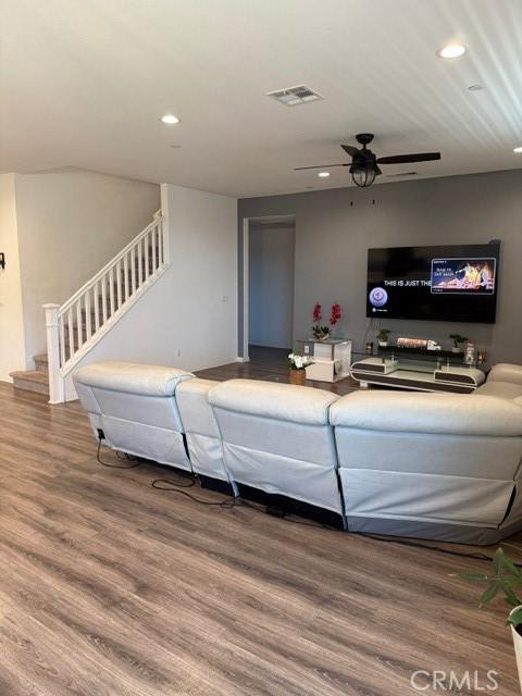 16009 Pitzer St, Fontana, CA 92336 - living room featuring recessed lighting, stairs, wood finished floors, and ceiling fan