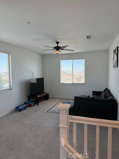 16009 Pitzer St, Fontana, CA 92336 - living area with plenty of natural light, a ceiling fan, and carpet flooring