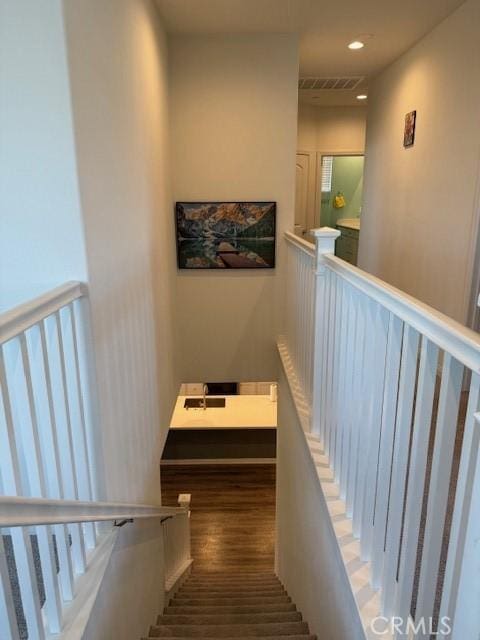 16009 Pitzer St, Fontana, CA 92336 - staircase featuring recessed lighting and wood finished floors
