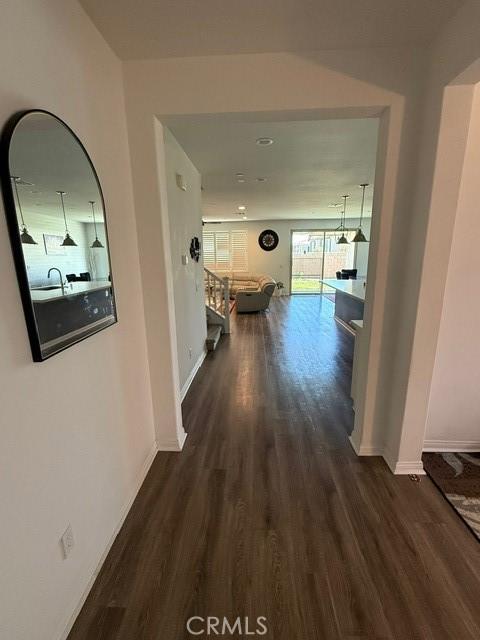 16009 Pitzer St, Fontana, CA 92336 - hallway with dark wood-type flooring